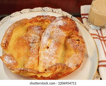 Dutch Baby Pancake Sprinkled With Powdered Sugar