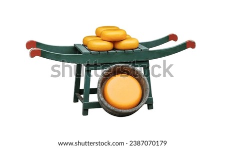 Dutch cheese barrow on a traditional wooden carring stretcher, isolated on white background. Many big wheels of holland cheese on vintage street counter of cheese store in Amsterdam, Netherlands. 