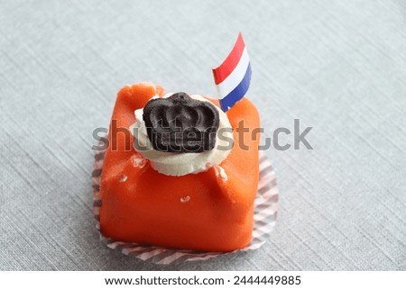 Dutch King´s Day pastry on April 27th, decorated with flag and a crown. Orange is the Dutch nationale color
