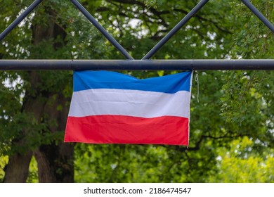 The Dutch Farmers Are Protesting (Boerenprotest) At Government Aims To Reduce Nitrogen (stikstof) Compound Emissions, Netherlands Flag On Trafic Light Pole In Countryside Farm As Protest, Netherlands.