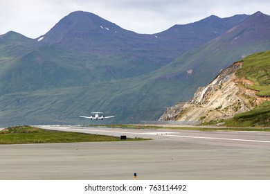 Dutch Harbor, Unalaska, Alaska, USA - August 14th, 2017: An airplane taking off the runway of the Tom Masden Airport, Dutch Harbor, Unalaska, Alaska.