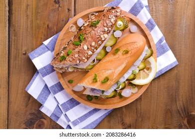 Dutch Herring. Toast With Dutch Herring, Onions, Pickles. Traditional Rustic Appetizer With Seafood. Popular Food In The Netherlands. View From Above.