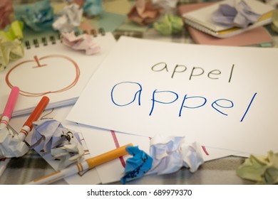 Dutch; Kids Writing Name Of The Fruits For Practice