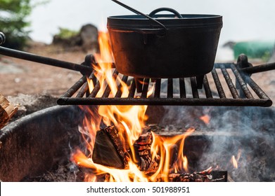 Dutch oven cooking over a campfire  - Powered by Shutterstock