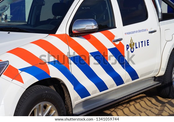 A Dutch police car\
with text and logo. Nobody in the vehicle. 2 September 2018. Den\
Haag. Netherlands