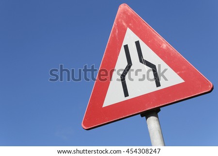 Dutch road sign: road narrows on both sides