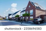 Dutch Suburban area with modern family houses, newly built modern family homes in the Netherlands, family house in the Netherlands, newly built houses in a family friendly modern suburban neighborhood