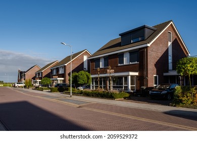 Dutch Suburban area with modern family houses, newly build modern family homes in the Netherlands, dutch family house, apartment house. Netherlands, newly build street with modern house