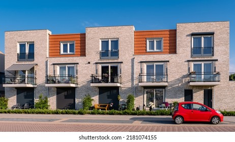 Dutch Suburban area with modern family houses, newly build modern family homes in the Netherlands, dutch family houses, and apartment houses. In the Netherlands, newly build streets with modern house