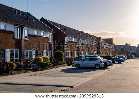 Dutch Suburban area with modern family houses, newly build modern family homes in the Netherlands, dutch family house, apartment house. Netherlands, newly build street with modern house