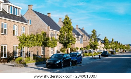 Dutch Suburban area with modern family houses, newly build modern family homes in the Netherlands, dutch family house in the Netherlands, Modern green neighbourhood