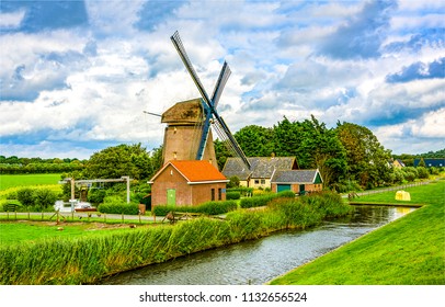 Dutch windmill farm in spring landscape
