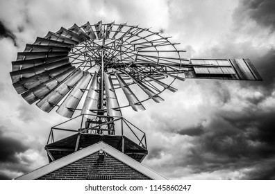 Dutch windmills with dramatic cloudy sky close-up.