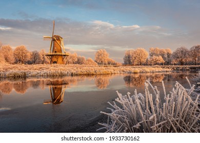 Dutch winter landscape with  scaffolding corn mill along the Hunze river - Gasselternijveen, Hunzedal, Drenthe, The Netherlands. - Powered by Shutterstock