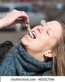 Dutch Woman Is Eating Typical Raw Herring With Onions