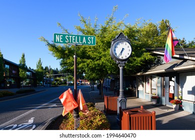 Duvall, WA, USA - June 20, 2021; Main Street In Downtown Duvall Washington At The Junction Of NE Stella St.  A LGBTQ Flag Flies On City Hall And The Clock Tells Time