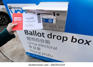 Duvall, WA, USA - October 30, 2021; Voter Depositing Mail Ballot Into Curb Side Drop Box In King County, Washington State For An Upcoming Election