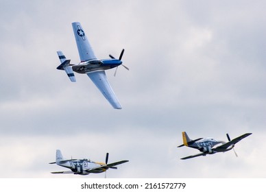 Duxford Airfield Cambridge, United Kingdom -  July 14th 2014:

Warbird fighter planes perform in the skies at Duxford flying legends air show.