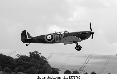 Duxford Airfield Cambridge, United Kingdom -  July 14th 2014:

Warbird fighter planes perform in the skies at Duxford flying legends air show.