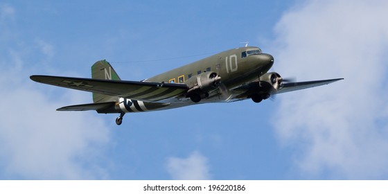 DUXFORD, CAMBRIDGESHIRE, UK - MAY 25: C-47A Skytrain (1D) flying on May 25, 2014 at the Duxford D-Day Air Show at Duxford, Cambridgeshire, UK. 