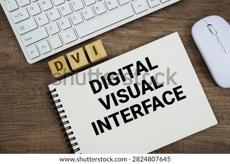 DVI Digital Visual Interface message with keyboard and optical mouse on wooden background