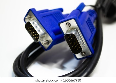 DVI and D-SUB cable for LCD and CRT monitors isolated on white background. Electronic black wire with blue connector.
