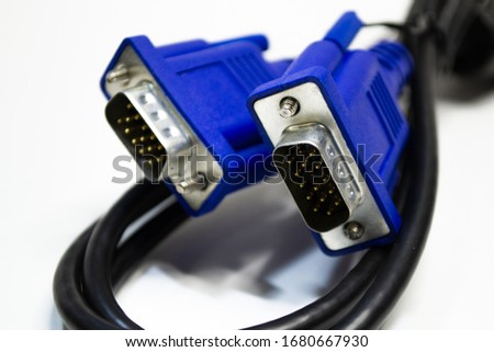 DVI and D-SUB cable for LCD and CRT monitors isolated on white background. Electronic black wire with blue connector.