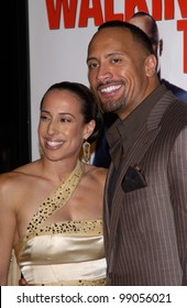 DWAYNE "THE ROCK" JOHNSON & wife DANY GARCIA at the world premiere, in Hollywood, of his new movie Walking Tall. March 29, 2004