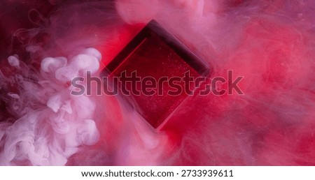 Dye cube. Neon cloud texture. Red purple color shiny splash vapor smoke water fume pigment spill on abstract defocused art background.