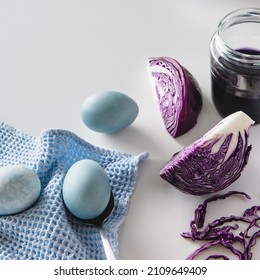 Dyed Blue Easter Eggs Painted With Natural Dye Red Cabbage On White Background.