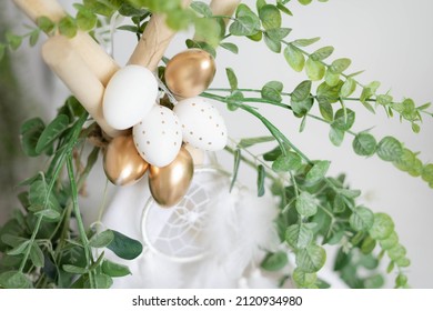 Dyed Golden Eggs On Top Of A Boho Teepee With Dream Catcher And Eucalyptus. Decorations For Easter.