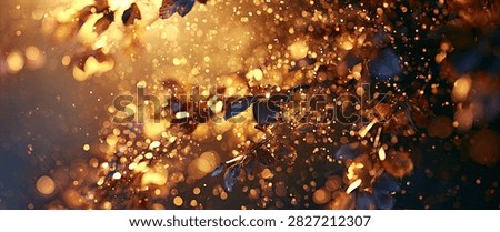 A dynamic abstract background featuring swirling golden bokeh lights and dark blue particles, creating a sense of movement and depth.