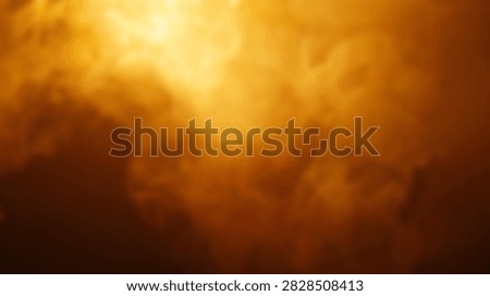 A dynamic abstract background featuring swirling golden smoke with bright light effects, creating a sense of energy and warmth.