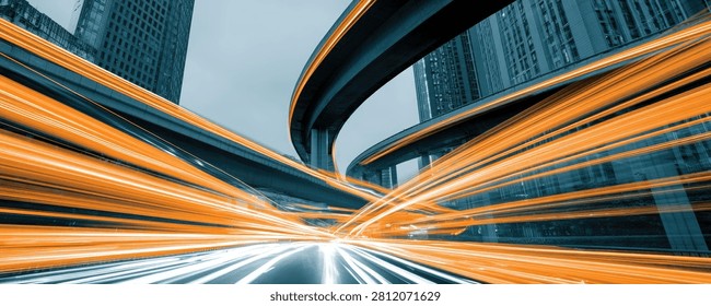 Dynamic abstract image capturing the essence of speed and urban movement through light trails on a highway at night.