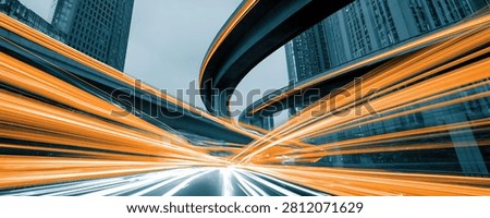 Dynamic abstract image capturing the essence of speed and urban movement through light trails on a highway at night.