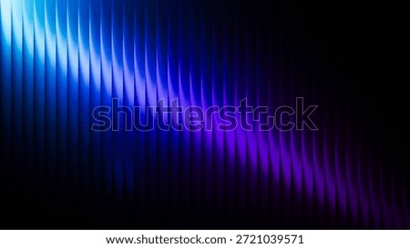 Dynamic abstract image featuring blue and purple light waves on a dark background. The gradient effect creates a futuristic and vibrant visual appeal.