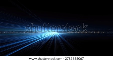 Dynamic abstract image featuring bright blue light streaks radiating from a central point, creating a sense of speed and motion against a dark background.