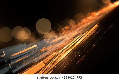 Dynamic abstract image featuring streaks of orange and yellow light with a bokeh effect, suggesting speed and energy.
