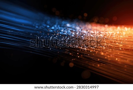 A dynamic abstract visualization of digital data streams in blue and orange hues, with sparkling particles suggesting information transfer.