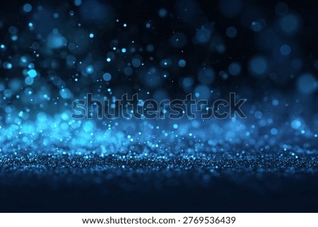 Dynamic Blue particles and Abstract background with a beautiful Bokeh effect, Glowing lights, and a mysterious Dark background for modern designs.