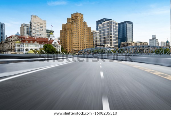 Dynamic blurry highway and city skyline in\
Shanghai, China