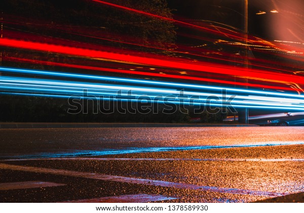 Dynamic car light\
trails in the dark – Abstract background of moving traffic made\
with long exposure shot