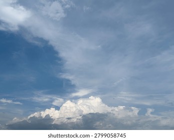 Dynamic celestial canvas displaying a vibrant split between clear azure and evolving atmospheric