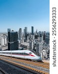 Dynamic Cityscape with High-Speed Train Against Urban Skyline  