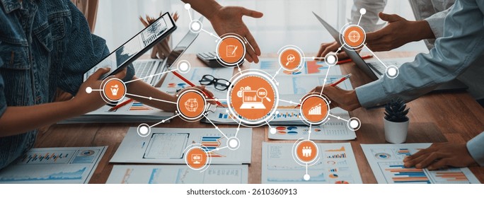 A dynamic collaborative workspace featuring diverse digital tools. Professionals engage in productive discussions, analyzing data and strategizing for innovative business solutions. Amity