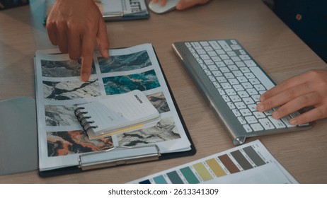 A dynamic creative workspace showcasing mood boards and color palettes. Professional hands engaging with plans and ideas, highlighting collaboration and design processes. SACTR
