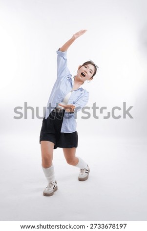 Dynamic Dance: A captivating dancer strikes a pose, her form suggesting fluid movement and embodying energy and passion.