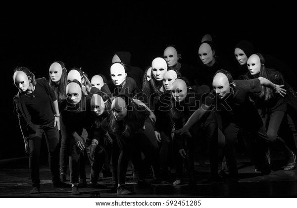dynamic dance drama on stage in theater-\
theater group on stage - Masks on stage in\
theater