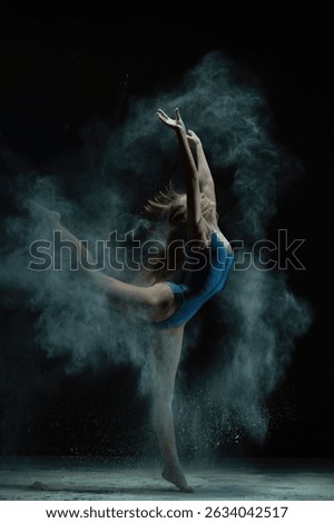 Dynamic dance performance with smoke effect showcasing athleticism and grace