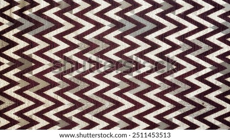 A dynamic geometric zig-zag pattern with bold, symmetrical lines, combining bright and contrasting colors to create an eye-catching and modern visual effect. Perfect for backgrounds, graphic design